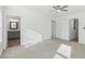 Bedroom featuring plush carpeting, ceiling fan, and access to the en suite bathroom at 4179 Hanes Dr, Decatur, GA 30035
