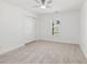 Bright bedroom featuring plush carpet, a ceiling fan, and a window at 4179 Hanes Dr, Decatur, GA 30035