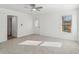 Bedroom with neutral carpet, ceiling fan, and outdoor access at 4179 Hanes Dr, Decatur, GA 30035