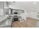 Bright kitchen with gray cabinets, stainless appliances, and open layout at 4179 Hanes Dr, Decatur, GA 30035