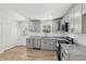 Modern kitchen featuring grey cabinetry and stainless-steel appliances at 4179 Hanes Dr, Decatur, GA 30035
