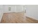 Spacious living room features light wood flooring, white walls, and ample natural light at 4179 Hanes Dr, Decatur, GA 30035