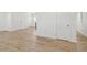 Spacious living room featuring light wood flooring and ample natural light at 4179 Hanes Dr, Decatur, GA 30035