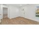 Bright, open living space with light wood flooring, white walls, and large windows at 4179 Hanes Dr, Decatur, GA 30035