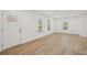 Light-filled living room with light wood floors, neutral walls, and an inviting front door at 4179 Hanes Dr, Decatur, GA 30035