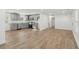 Open-concept living room and kitchen with modern gray cabinetry and stainless steel appliances at 4179 Hanes Dr, Decatur, GA 30035