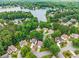 Aerial view of property nestled within lush trees near the beautiful Lake Norman at 7115 Harbour Lndg, Alpharetta, GA 30005