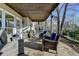 Spacious covered back porch offering a seating area with outdoor views at 7115 Harbour Lndg, Alpharetta, GA 30005