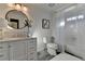Elegant bathroom with a modern vanity, decorative mirror, and shower with a tub at 7115 Harbour Lndg, Alpharetta, GA 30005