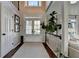 Entryway featuring natural light, soaring ceilings, hardwood floors and staircase at 7115 Harbour Lndg, Alpharetta, GA 30005