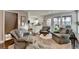 Comfortable living room featuring hardwood floors and access to the kitchen and outdoor patio at 7115 Harbour Lndg, Alpharetta, GA 30005