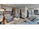 Comfortable living room showcases plush seating, hardwood floors, and easy access to the kitchen at 7115 Harbour Lndg, Alpharetta, GA 30005