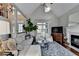 Open living room featuring fireplace, large windows, vaulted ceilings, and lots of natural light at 7115 Harbour Lndg, Alpharetta, GA 30005