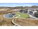 Stunning aerial view showcasing the community's outdoor amphitheater, pond, and walkable shops at 1645 Renfroe Run, Cumming, GA 30041