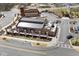 Stunning aerial view of a restaurant with outdoor patio seating and ample parking at 1645 Renfroe Run, Cumming, GA 30041