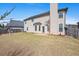 Spacious backyard offers a patio for outdoor dining and relaxation, with a privacy fence surround at 1645 Renfroe Run, Cumming, GA 30041