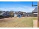 Large backyard with a playset, storage shed, and a partial fence for privacy at 1645 Renfroe Run, Cumming, GA 30041