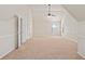 Large bedroom features neutral carpet and vaulted ceiling with great natural light from a window at 1645 Renfroe Run, Cumming, GA 30041