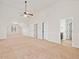 Large bedroom has neutral carpet and paint, with easy access to multiple rooms and a bathroom at 1645 Renfroe Run, Cumming, GA 30041