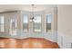 Bright breakfast nook featuring hardwood floors, plenty of natural light, and neutral paint at 1645 Renfroe Run, Cumming, GA 30041