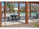 Community pool with picnic table and seating with shade for residents and visitors at 1645 Renfroe Run, Cumming, GA 30041