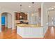 Modern kitchen with stainless steel appliances, granite countertops, and a stylish breakfast bar at 1645 Renfroe Run, Cumming, GA 30041