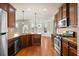 Updated kitchen with stainless steel appliances, granite countertops, and ample cabinet space at 1645 Renfroe Run, Cumming, GA 30041