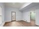 Basement room featuring vinyl plank flooring, trimwork, and an exterior door at 3655 Autumn Pkwy, Marietta, GA 30066