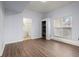 Bright basement area with wood-look floors, view to a bathroom and storage closet at 3655 Autumn Ridge Pkwy, Marietta, GA 30066
