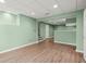The basement has light-green walls, vinyl floors, recessed lighting, and a bar-like structure at 3655 Autumn Ridge Pkwy, Marietta, GA 30066
