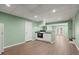 Basement area with light-green walls, vinyl floors, kitchen, and recessed lighting at 3655 Autumn Ridge Pkwy, Marietta, GA 30066