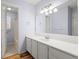 Bathroom with white vanity, an oversized mirror, and a tub/shower combo at 3655 Autumn Ridge Pkwy, Marietta, GA 30066