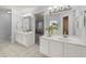 Bright bathroom featuring double sink vanity, tile flooring, and an opening to the main bedroom at 3655 Autumn Ridge Pkwy, Marietta, GA 30066