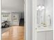 Well-lit half bathroom with modern sink and large mirror is located off the main living area at 3655 Autumn Ridge Pkwy, Marietta, GA 30066