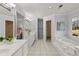 Large bathroom with dual vanity, soaking tub, tile flooring, and view to the main bedroom at 3655 Autumn Ridge Pkwy, Marietta, GA 30066