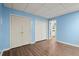 Bedroom with wood-look floors, a closet with bi-fold doors and another with double doors at 3655 Autumn Ridge Pkwy, Marietta, GA 30066