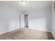 Neutral bedroom with carpet, baseboard trim, and an attached closet at 3655 Autumn Ridge Pkwy, Marietta, GA 30066