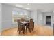 Bright dining room featuring hardwood floors and a view of the surrounding landscape at 3655 Autumn Ridge Pkwy, Marietta, GA 30066