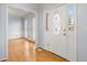 Bright foyer with hardwood floors and decorative leaded glass sidelights at 3655 Autumn Ridge Pkwy, Marietta, GA 30066