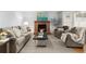 Spacious living room with a brick fireplace, comfortable seating, and lots of natural light at 3655 Autumn Ridge Pkwy, Marietta, GA 30066