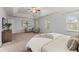 Spacious main bedroom with sitting area, carpet, ceiling fan, and lots of natural light at 3655 Autumn Ridge Pkwy, Marietta, GA 30066