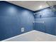 Unfinished room painted dark blue with gray concrete flooring at 3655 Autumn Ridge Pkwy, Marietta, GA 30066