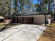 Inviting single-story home with a spacious carport and a well-manicured lawn at 4430 Locksley Rd, Tucker, GA 30084