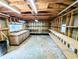 Unfinished garage space with work bench area and lots of built in shelving at 4430 Locksley Rd, Tucker, GA 30084