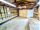 A garage space with lots of built in shelving and a work bench area at 4430 Locksley Rd, Tucker, GA 30084