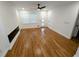 Bright living room with hardwood floors, modern fireplace, and natural light at 4430 Locksley Rd, Tucker, GA 30084