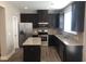 Modern kitchen with stainless steel appliances and granite countertops at 849 Arbor Crowne Dr, Lawrenceville, GA 30045