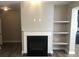 Cozy living room showcasing a fireplace and built-in shelves at 849 Arbor Crowne Dr, Lawrenceville, GA 30045