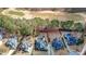 An aerial view shows a manicured golf course and neighboring homes, several with in-ground swimming pools at 151 Creek Bank Dr, Acworth, GA 30101