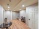 Finished basement area with sleek flooring, ample lighting, and a convenient staircase at 151 Creek Bank Dr, Acworth, GA 30101